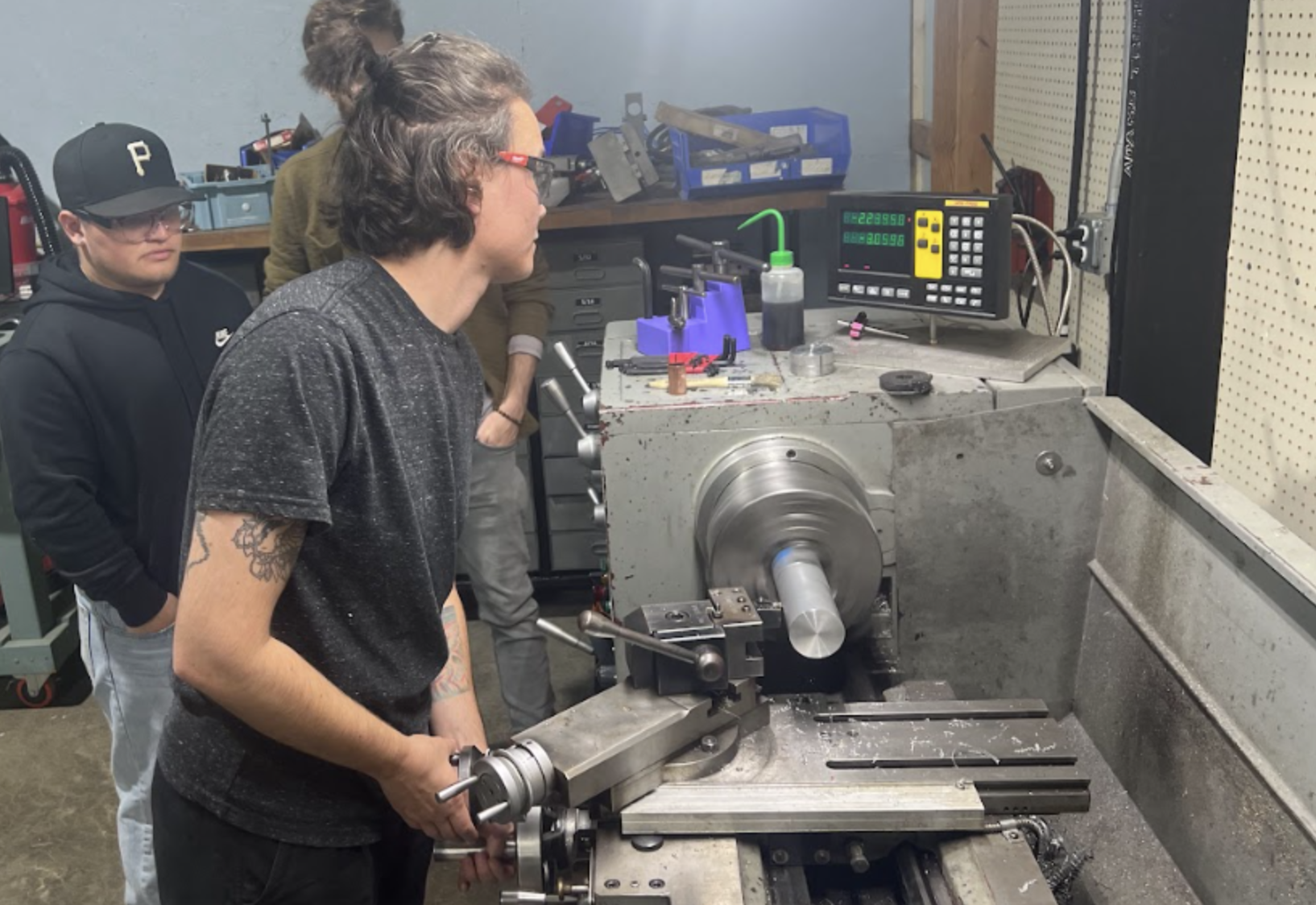Student running a lathe